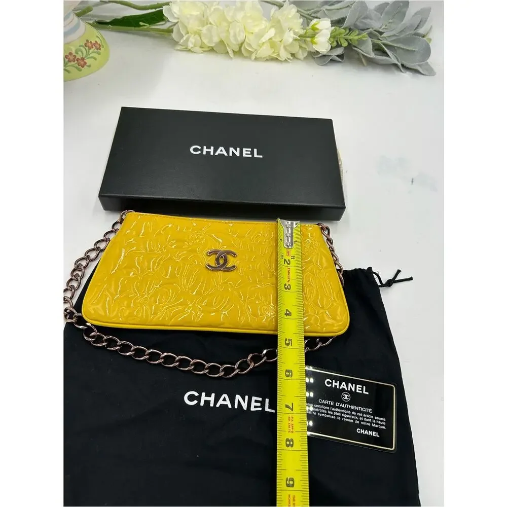 Women's Chanel patent leather floral embossed shoulder bag made in Italy